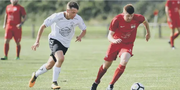  ??  ?? Northern League Football between Washington (red) and West Auckland, played at Nissan Sports Complex.