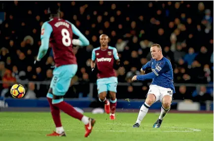  ?? PHOTO: GETTY IMAGES ?? Wayne Rooney displays perfect technique as he takes aim from inside his own half and scores for Everton against West Ham.