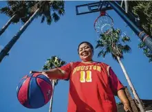  ?? Mark Mulligan / Staff photograph­er ?? Moutra asked for a basketball hoop for her 65th birthday so she could stay active and interact with her family.