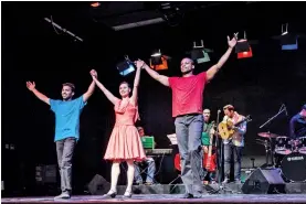  ??  ?? Iraqi dancer Faraj ( from left) and his American mentors Mira Cook and Sean Scantlebur­y pose after performing at the Amman Contempora­ry Jazz Festival in Amman, Jordan.