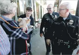  ?? Gary Coronado Los Angeles Times ?? LAPD OFFICER J.C. Duarte, right, and his recently retired partner Harold Marinelli, center right, skipped promotions in favor of patrolling the streets.