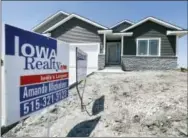  ?? THE ASSOCIATED PRESS ?? A sign sits in front of a new home for sale in West Des Moines, Iowa. A buying spree in the Midwest spurred new U.S. home sales last month to the fastest pace since July.