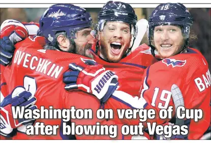 ?? AP ?? ONE TO GO: Alexander Ovechkin and Nicklas Backstrom celebrate with John Carlson of Iselin, N.J., after Carlson’s goal to put the game out of reach in the Capitals’ 6-2 win over the Golden Knights to take a 3-1 series lead.