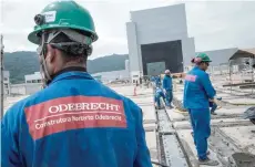  ?? — AFP ?? Workers of Brazilian constructi­on company Odebrecht build the new naval submarine base in Itaguai, some 70 km south from Rio de Janeiro, Brazil.