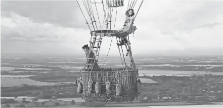 ??  ?? In “The Aeronauts,” daredevil balloon pilot Amelia Wren ( Felicity Jones) teams up with pioneering meteorolog­ist James Glaisher ( Eddie Redmayne) to advance human knowledge of the weather and fly higher than anyone in history.