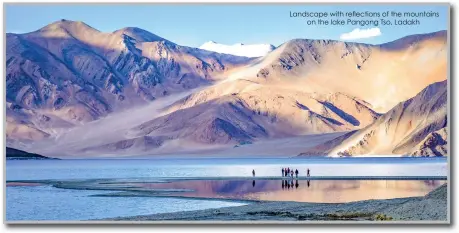  ??  ?? Landscape with reflection­s of the mountains on the lake Pangong Tso, Ladakh