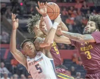  ?? AP ?? Illinois guard Tevian Jones battles for a rebound Wednesday night at State Farm Center in Champaign.