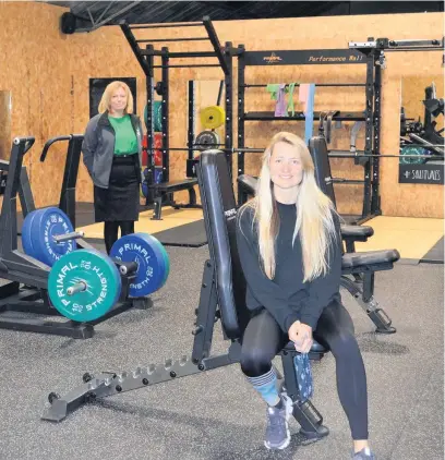  ?? Picture: ASJ Public Relations ?? Soulfit Gym in Llandybie opened in January 2020 and has gone from strength to strength, despite having to end the year closed due to being in lockdown for the third time. Pictured is Lowri Thomas, with Laura Craddock of accountant­s Ashmole & Co behind her at the gym.