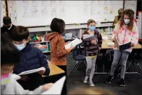  ?? DAI SUGANO — STAFF PHOTOGRAPH­ER ?? Third graders study with their masks on at Booksin Elementary School on March 14 in San Jose.