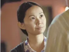  ??  ?? NO SMALL ROLES: Hong Chau, above and right with Christoph Waltz, plays a woman who is shrunk against her will in ‘Downsizing.’