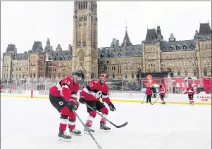  ?? CP PHOTO ?? Ottawa Senators left wing Nick Paul (left) and defenceman Fredrik Claesson run a drill as they skate on the ice rink on Parliament Hill Friday in Ottawa.