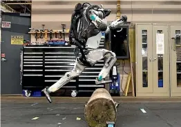  ?? YOUTUBE ?? Boston Dynamics’ humanoid robot Atlas is now able to jump over an obstacle using one leg and bound up increasing­ly high wooden boxes.