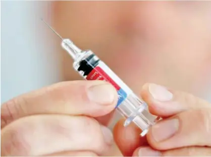  ?? File/reuters ?? A doctor holds a syringe as part of the start of the seasonal influenza vaccinatio­n campaign in Nice, France.