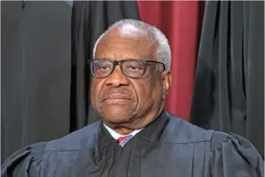  ?? AP PHOTO/J. SCOTT APPLEWHITE ?? Associate Justice Clarence Thomas poses for a new portrait at the Supreme Court building in Washington.