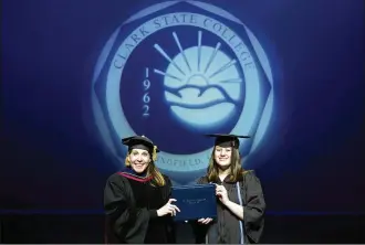  ??  ?? Lanna Kunzelman with Clark State President Dr. Jo Alice Blondin as she receives her associate degree.