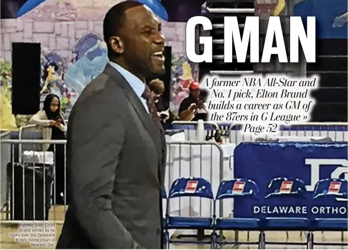  ??  ?? Former Sixer Elton Brand smiles as he looks over the Delaware 87ers’ home court in Newark, Del.