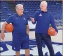  ?? Mike Anthony / Hearst Connecticu­t Media ?? UConn basketball coaches Geno Auriemma, left, and Dan Hurley chat before filming a public service announceme­nt in Gampel Pavilion on June 9, 2021.