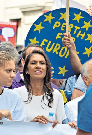  ??  ?? Pro-EU campaigner Gina Miller joins crowds in central London yesterday during the People’s Vote march for a second EU referendum