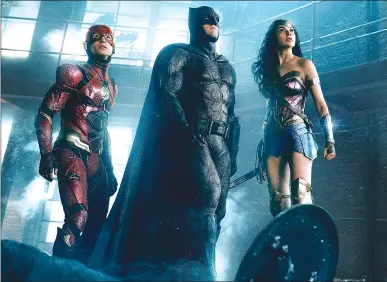  ?? Associated Press photo ?? This image released by warner Bros. Pictures shows Ezra Miller, from left, Ben Affleck and Gal Gadot in a scene from “Justice League.”