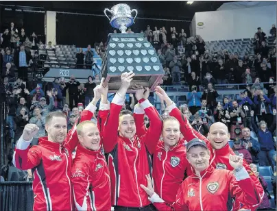  ?? THE CANADIAN PRESS/ANDREW VAUGHAN ?? Team Canada, from left, skip Brad Gushue, third Mark Nichols, second Brett Gallant, from Charlottet­own, lead Geoff Walker, coach Jules Owchar and alternate Tom Sallows hold the Brier Tankard after defeating Alberta 6-4 to win the Tim Hortons Brier on...