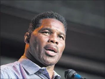  ?? Akili-Casundria Ramsess The Associated Press file ?? Herschel Walker, a Georgia Republican candidate for the U.S. Senate, seen speaking at a primary watch party May 23 in Athens, Ga., said Saturday he “never denied” the existence of children he had not previously disclosed publicly.