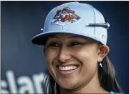  ?? BEBETO MATTHEWS - THE ASSOCIATED PRESS ?? Kelsie Whitmore, a 23-year-old two-way player for the Atlantic League’s Staten Island FerryHawks, smiles in her team’s dugout before gametime, Friday, May 13, 2022, in New York.