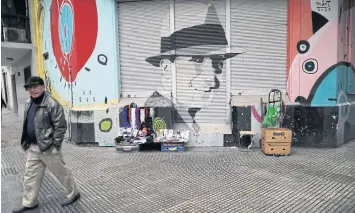  ??  ?? A mural of Carlos Gardel near the Carlos Gardel museum in Buenos Aires.