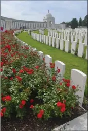  ??  ?? The Tyne Cot cemetery in Belgium is the largest cemetery for Commonweal­th forces in the world. It remembers nearly 12,000 fallen. The wall at left lists those without graves.