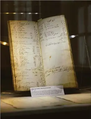  ?? H John Voorhees III / Hearst Connecticu­t Media ?? A ledger for the Keeler, Dauchy & Olmsted store, part of a new exhibit at The Keeler Tavern Museum & History Center.