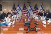  ?? JACQUELYN MARTIN — THE ASSOCIATED PRESS ?? Israeli Defense Minister Yoav Gallant, at far left, speaks while meeting with Defense Secretary Lloyd Austin, across table at far right, at the Pentagon in Washington on Tuesday.
