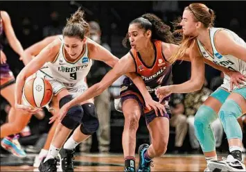  ?? Sarah Stier / Getty Images ?? The Mercury’s Skylar Diggins-smith, center, seen during the 2021 season, made a steal in the third quarter against Washington to reach 300 for her career. The Mystics won 83-65.