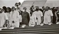  ?? Ed Clemente / AFP via Getty Images ?? Mourners pay their respects to George Floyd at a church in Raeford, N.C., the state where he was born.