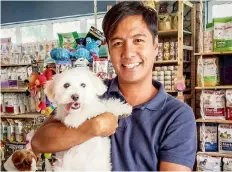  ??  ?? NO BAD DAYS: Full time petsitter, Rusty Madriaga says, “When you work with dogs and cats, you get unconditio­nal love and loyalty in return. The biggest advantage is that you are always happy with your job.”