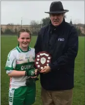  ??  ?? Baltinglas­s captain Lia Arnold O’Brien collects the Féile cup from Dominic Leech.