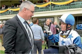  ?? PHOTO: TRISH DUNELL ?? Bostonian’s jockey Mark Du Plessis in discussion with trainer Tony Pike after the Hawke’s Bay Guineas.