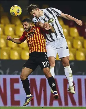  ??  ?? Going head on: Juventus’ Matthijs De Ligt (right) in action against Benevento’s Gianluca Caprari during the Serie A match. — AP