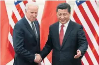  ?? LINTAO ZHANG THE ASSOCIATED PRESS FILE PHOTO ?? Joe Biden, then U.S. vice-president, and Chinese President Xi Jinping in 2013. While aides say Biden will take a new tack on trade, his predecesso­r’s tariffs on Chinese goods will likely hold.