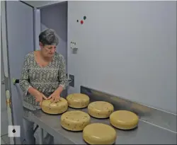  ??  ?? 6 6: The ageing cheeses are checked and rotated as needed, and then moved on to the next stage of the ageing process.