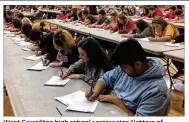  ?? JEREMY P. KELLEY / STAFF ?? West Carrollton high school seniors sign “letters of intent,” stating their post-graduation plans for college, military service or entering the workforce on Thursday.