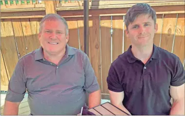  ?? AP-Dan Sewell ?? Buck Newsome, left, a Baby Boomer, and his son, Chris Newsome, of the Millennial generation, pose for a photo while having lunch together in Newtown, Ohio, on June 26. American’s two largest generation­s can agree on something: the coronaviru­s pandemic has hit them both hard.