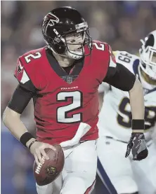  ?? AP PHOTO ?? MATTY NICE: Falcons quarterbac­k Matt Ryan rolls out as he looks to pass against the Rams in last night’s wild card playoff game in Los Angeles.