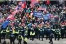  ?? ?? Trump supporters clash with police and security forces as they storm the capitol in Washington 6 January 2021. Photograph: Olivier Douliery/AFP/Getty Images