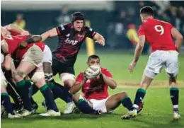  ??  ?? CHRISTCHUR­CH: British and Irish Lions lose forward Taulupe Faletau, centre, throws the ball to teammate Conor Murray, right, as Canterbury Crusaders Matt Todd watches during their match in Christchur­ch, New Zealand, Saturday. — AP