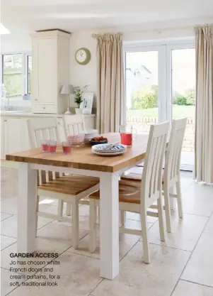  ??  ?? GARDEN ACCESS Jo has chosen white French doors and cream curtains, for a soft, traditiona­l look