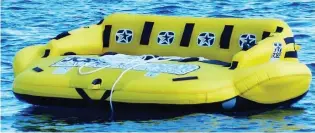  ??  ?? Died: Simon Crewe, 57 Holiday attraction: An inflatable sofa ride similar to that used by Mr Crewe