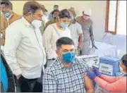  ?? ANI ?? A medic inoculates Vinay Pratap Singh, Commission­er of Municipal Corporatio­n Gurugram, on Monday.
