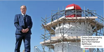  ?? CARMARTHEN­SHIRE COUNCIL ?? Emlyn Dole surveying the restoratio­n of Burry Port Harbour lighthouse.