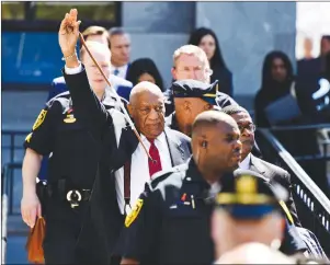  ?? AP PHOTO ?? Bill Cosby waves to his supporters as he leaves his sexual assault trial at the Montgomery County Courthouse, Thursday in Norristown, Pa. Cosby was convicted Thursday of drugging and molesting a woman in the first big celebrity trial of the #MeToo era.