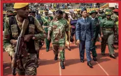  ??  ?? Army chief of staff Gen Constantin­o Chiwenga, centre, arrives for Mnangagwa’s inaugurati­on as the new president, 24 November