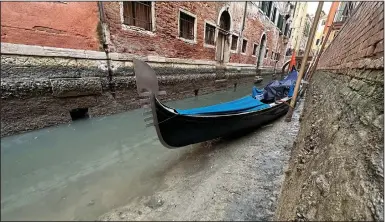  ?? ?? A gondola is docked Monday on a dry canal in Venice.